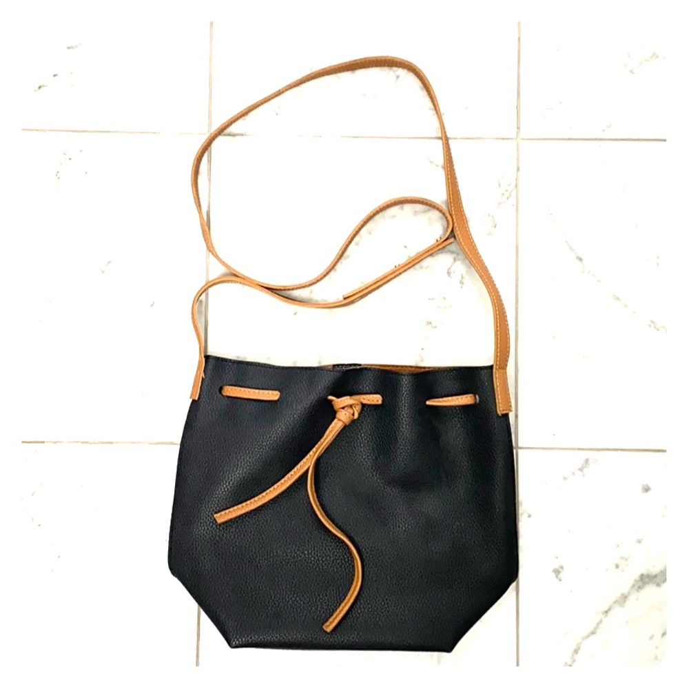 Navy and tan vegan leather cross body bag.